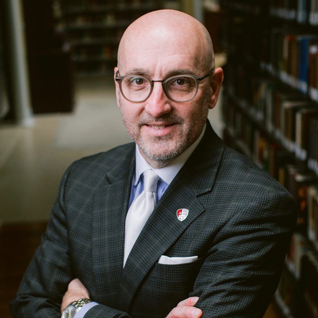 Dr. Guy M.